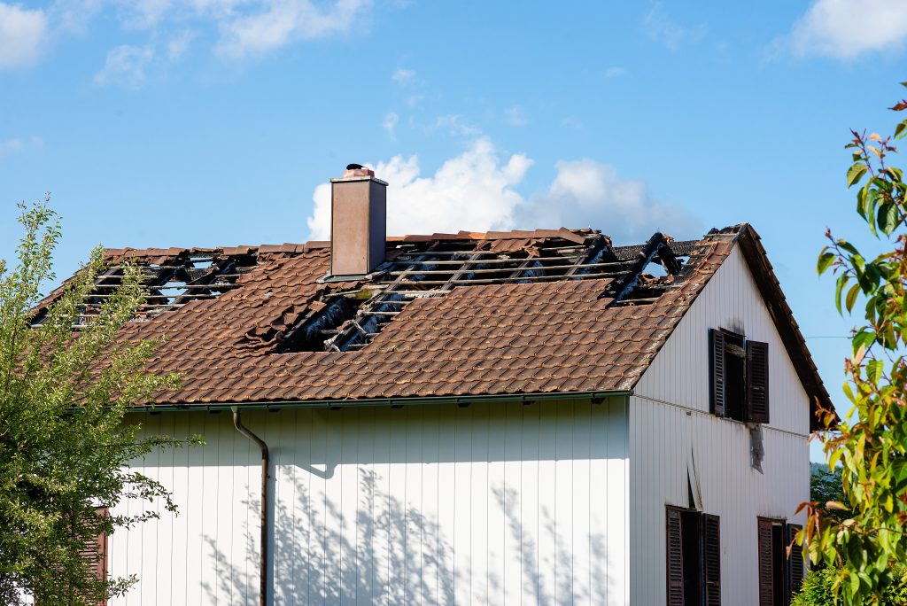 battered roof after a storm
